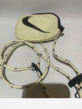Nike Pale Yellow Mini Crossbody Pouch with Black Swoosh
